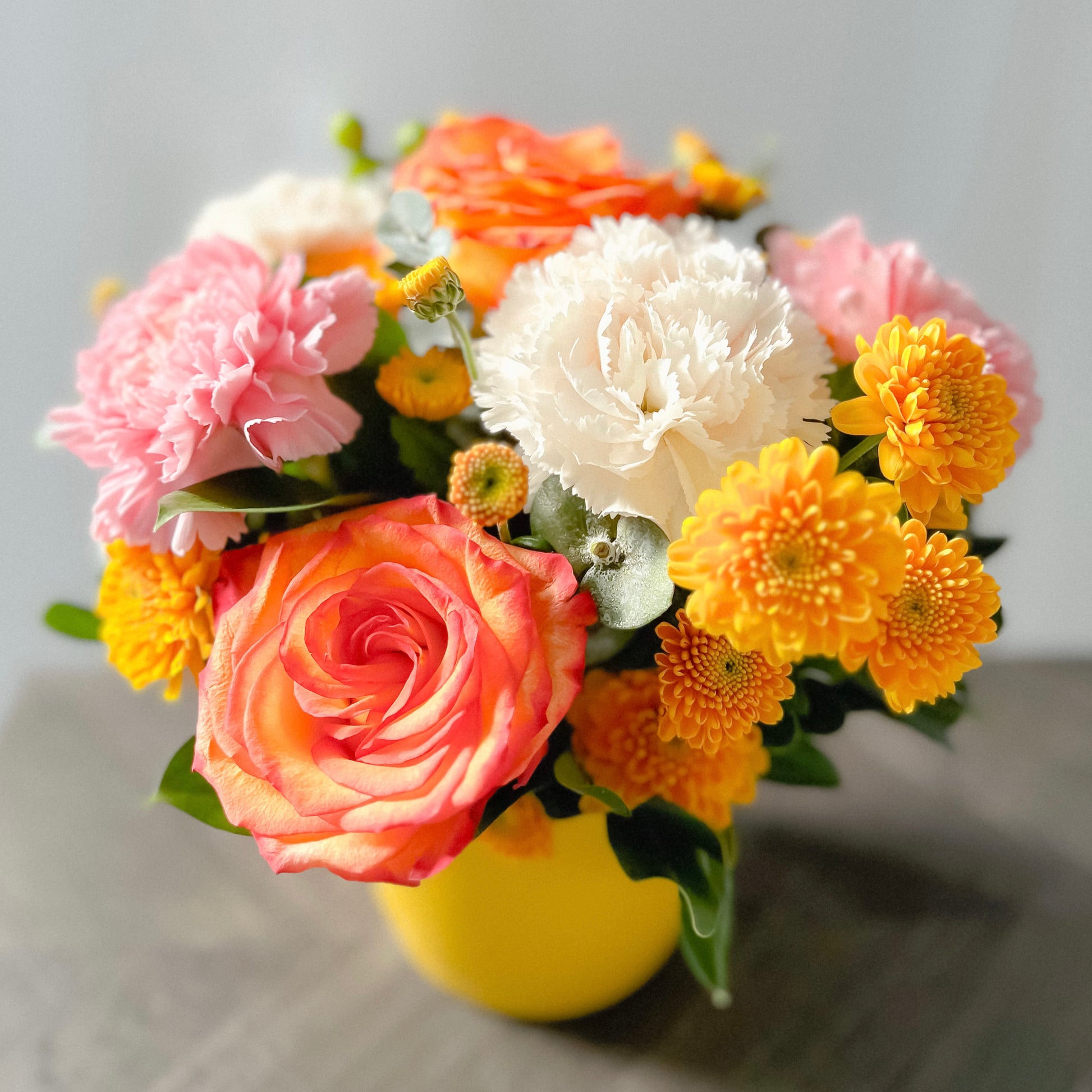 bright yellow and orange floral arrangement 